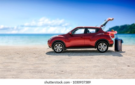 Red Summer Car On Beach With Few Suitcase And Free Space For Your Decoration. 