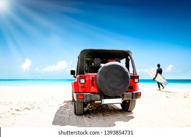 Red Summer Car On Beach. Landscape Of Ocean And Blue Sea With Sunny Day. Surfer On Beach With Board. Free Space For Your Decoration. 