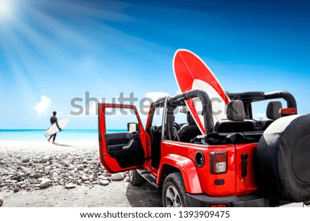 Red summer car on beach and surfer. Free space for your decoration and summer sunny day. 
