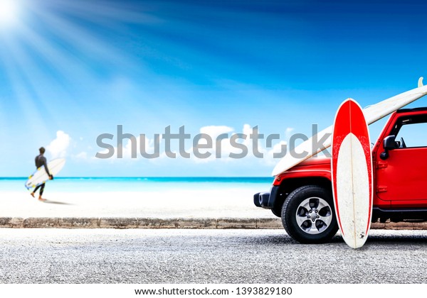 Red summer car on beach. Young\
surfer and summer sunny day. Free space for your decoration.\
