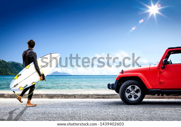 Red summer car on beach and summer sunny day.\
Landscape of sea and blue sky.\
