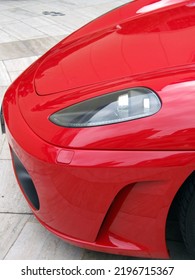 Red Supercar Nose On Grey Courtyard