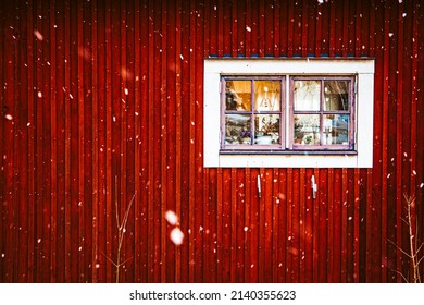 Red Swedish Farmhouse House In The Snow With Cozy Window View