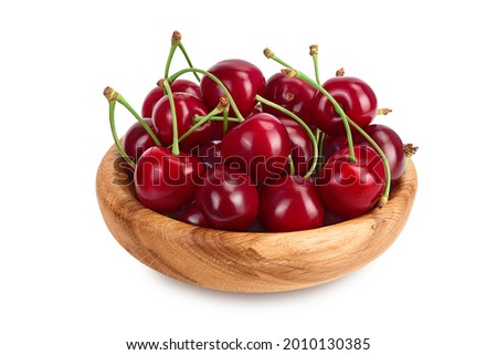 red sweet cherry in wooden bowl isolated on white background with clipping path and full depth of field