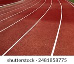 Red synthetic rubber running  track. Running lane of synthetic for sport outdoor.
