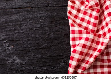 Red Table Cloth On Black Wooden Background