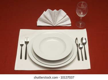 Red Tablecloth With A Place Setting For One