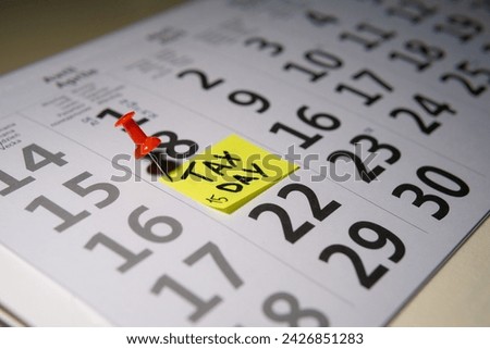 Red tack in calendar pointing at April 15th 2024, Tax Day in the USA for 2023 earnings. High quality photo