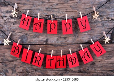 Red Tags Hanging on a Line with the Words Happy Birthday on it, Wooden Background - Shutterstock ID 225348685