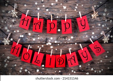 Red Tags with Happy Holidays on it Hanging on a Line on Wood with Snow, Christmas or Winter Holiday Greetings - Shutterstock ID 214151146