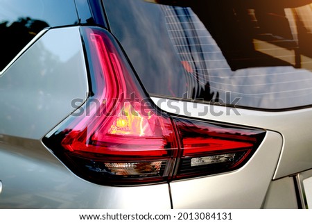 Red tail light while braking signal driving concept