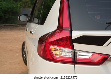 Red Tail Lights On A White Car