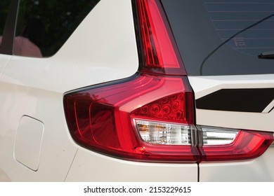 Red Tail Lights On A White Car