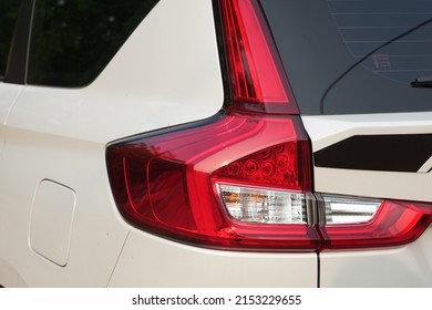 Red Tail Lights On A White Car