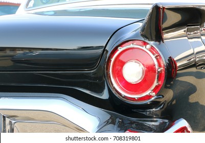 Red Tail Lights Of A Vintage Black Car.