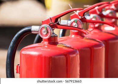 Red tank of fire extinguisher. Overview of a powerful industrial fire extinguishing system. Emergency equipment for industrial refinery crude oil and gas.compressed gas carbon dioxide in side. Fire