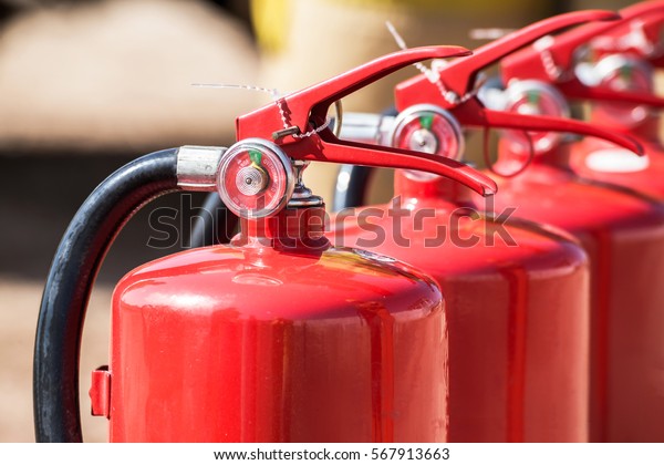 Red tank of fire extinguisher. Overview of a\
powerful industrial fire extinguishing system. Emergency equipment\
for industrial refinery crude oil and gas.compressed gas carbon\
dioxide in side. Fire