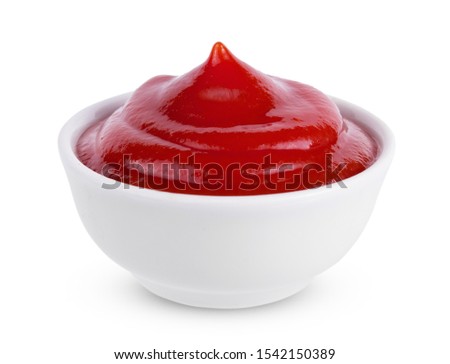 Red tasty ketchup or tomato sauce in bowl isolated on white background