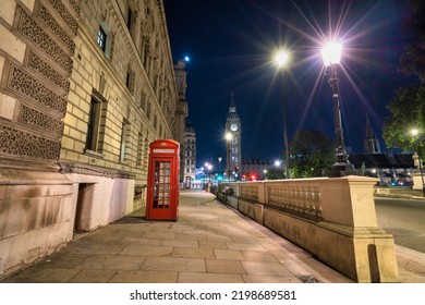 Red telephone booth and Big Ben at night in London. England - Powered by Shutterstock