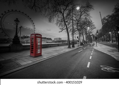 Red Telephone Booth Isolated On Black And White Street