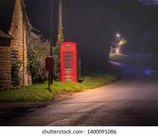 Red Telephone box at night in the Weston Subedge in Cotswolds - Powered by Shutterstock