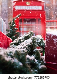 Red Telephone Box In The Snow. Telephone Booth In Winter. Christmas Tree, Gifts, Phone Booth.