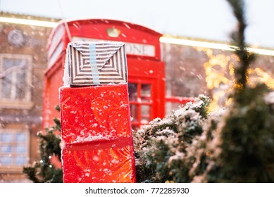 Red Telephone Box In The Snow. Telephone Booth In Winter. Christmas Tree, Gifts, Phone Booth.