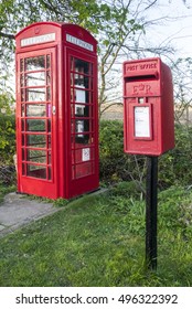 Red Telephone Box Used As Library With Post Box In Front