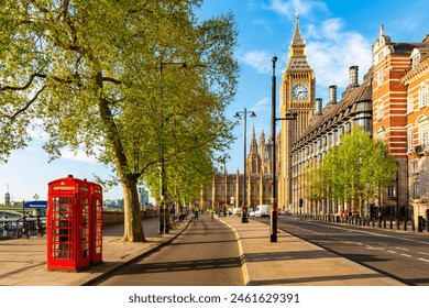 Red telephone boxes on Victoria embankment and Big Ben tower, London, UK - Powered by Shutterstock