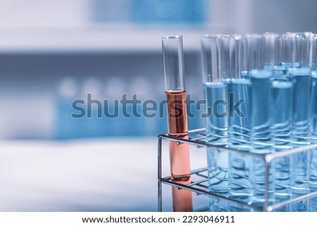 red test tube in blue rack, science research and development concept