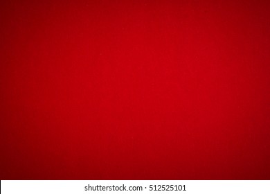 Red Textured Paper Background With Vignette.