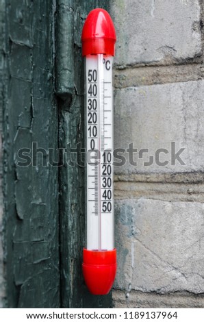 red thermometer. Vertical frame