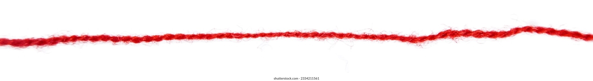 Red thread isolate on white background. Selective focus. Old.