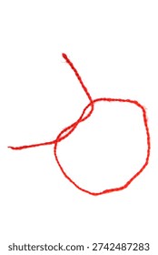 Red thread isolate on white background. Selective focus. Old.