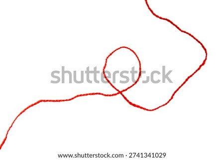 Red thread isolate on white background. Selective focus. Old.