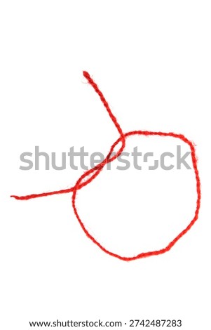 Red thread isolate on white background. Selective focus. Old.