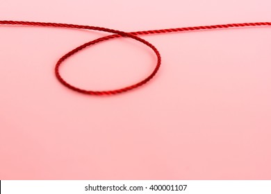 Red Thread On Red Background