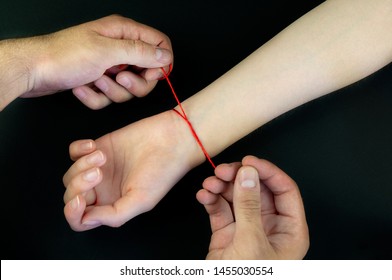 Red Thread On A Black Background In The Cart