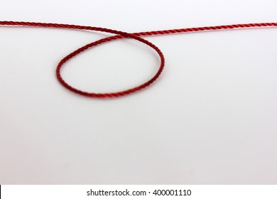 Red Thread On White Background