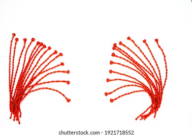 Red thread string on a white background
