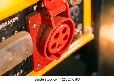 Red Three-pin Power Socket On The Gas Generator Housing Close-up