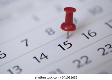 Red Thumb Tack On Calendar Page