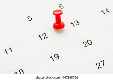 Red Thumb Tack On Calendar Page