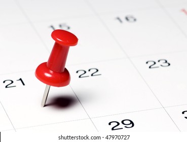 Red Thumb Tack On Calendar Page