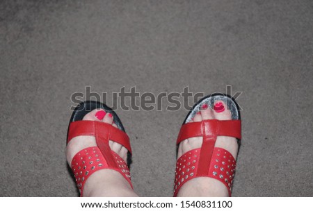 Red toe nails or red toenails with matching sandals.   Fancy feet