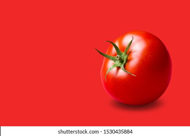 red tomato with a green stalk, on a red background, concept, copy space