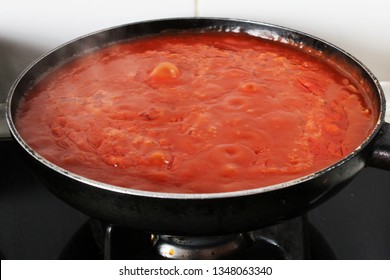 Red Tomato Sauce Cooking On Fire In A Pan