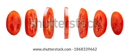 Red tomato slices levitating in the air isolated on white background