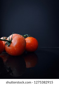 Red Tomatoes With Black Background. Group Of Tomatoes. Wallpaper Tomato Macro - Image

