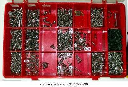 Red Tool Box Filled With Many Screws